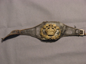 Image - Insignia, black leather arm rank strap with brass K.C. w/wreath